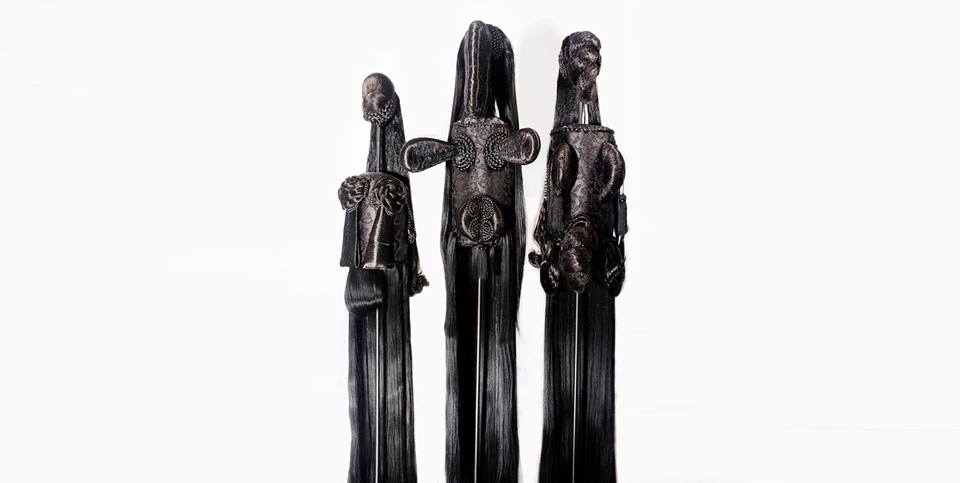 In a deep, dark forest they were braiding the beards of parrots in love